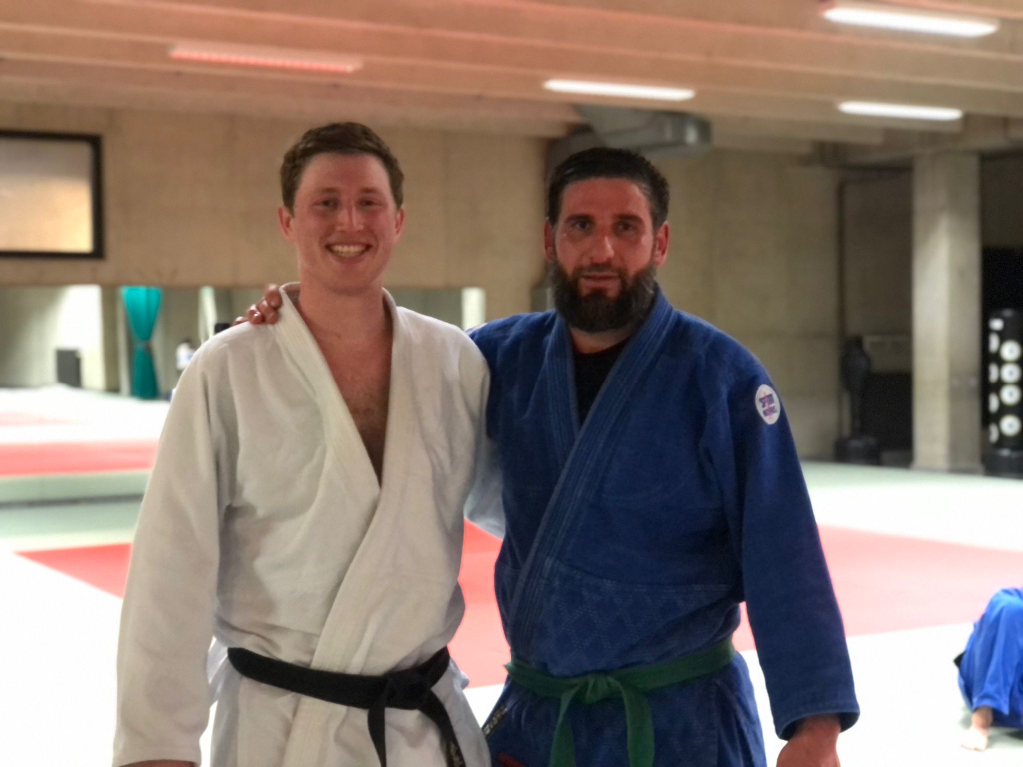 Sébastien Lamproye standing with a fellow judoka